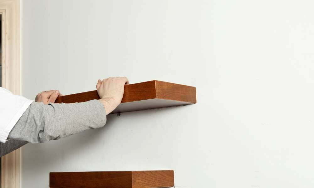 Hold your shelf to the wall for 30 seconds. How To Hang Floating Shelves Without Nails